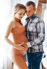 Naklejka premium Beauty Pregnant Woman . Pregnant Belly. Beautiful Pregnant Woman Expecting Baby. Maternity concept