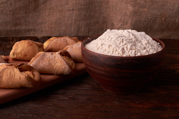 Close up Flour bread and whole grain , rolling pin and Cottage cheese cookies. Concept of homemade food