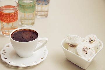 Turkish coffee with milk cream chocolate pistachio Turkish delight and cup of water