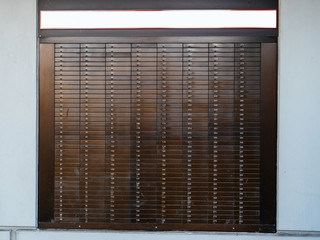 Detail of multiple Bank Deposit Boxes on a wall each of them numbered with dedicated number 