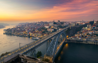 Porto panoramic aerial view of Dom Luis Bridge at sunset. Porto, Portugal. Cityscape of Porto downtown touristic Ribeira