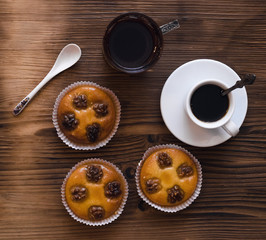 Shortbread cookies with walnuts and honey and cup of black coffee and hot tea.