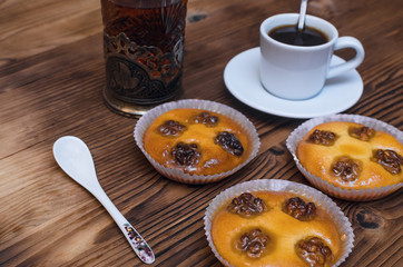 Shortbread cookies with walnuts and honey and cup of black coffee and hot tea.