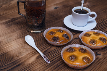 Shortbread cookies with walnuts and honey and cup of black coffee and hot tea.