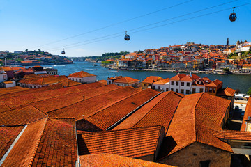 Porto, Portugal old town skyline with orange rooftops from vila nova de gaia on the Douro River