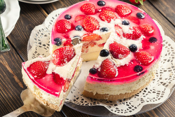 Cheesecake with strawberries, blueberry and jelly