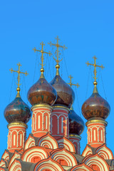 Fototapeta na wymiar Ancient domes of the Orthodox Russian Church with crosses