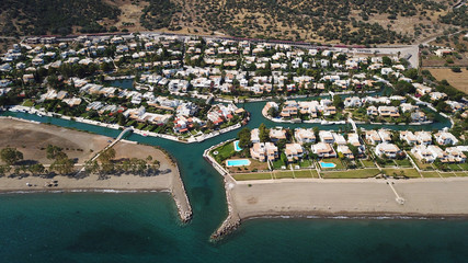 Aerial drone bird's eye view photo of famous seaside resort of Porto Hydra built on canals with...