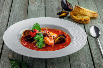 Delicious Italian tomato seafood on a table. Plate of classic healthy vegetable food.