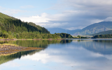 Fototapeta na wymiar Loch Leven. The view across Loch Leven from Ballachulish towards Ballachulish Bridge in the Scottish highlands. Loch Leven is a sea loch on the west coast of Scotland.