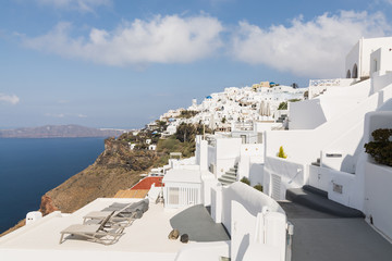 Fototapeta premium View over Aegean sea, Firostefani village and volcano caldera with luxury hotel on the foreground