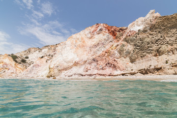 Fototapeta na wymiar Colourful rocks of Firiplaka beach on Milos island, Greece