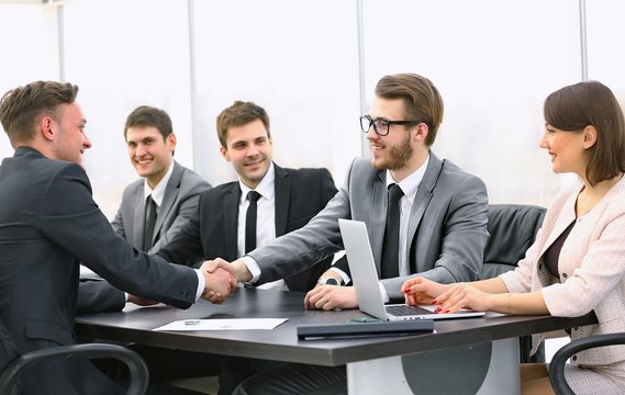 handshake of a Manager and a customer at the Desk