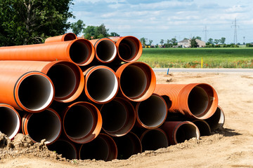 Orange plastic pipes