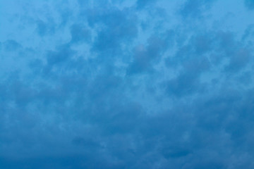 background / defocus. dark clouds against the background of the evening blue sky