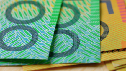 Macro closeup of Australian fifty and one hundred dollar notes, shallow dof.