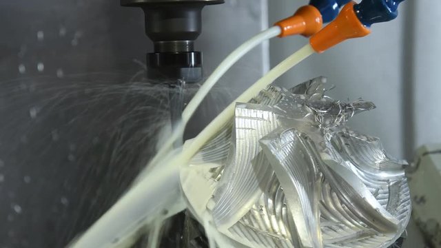 coolant and lubrication. Milling metalworking process. CNC machining by mill.