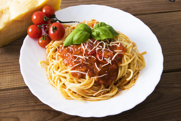 spaguetis pasta prepared with bolognese sauce and cheese
