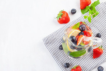 Herbs and fruits flavored infused water. Summer refreshing drink