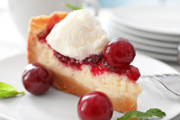 Delicious cheesecake with cherries on plate, closeup