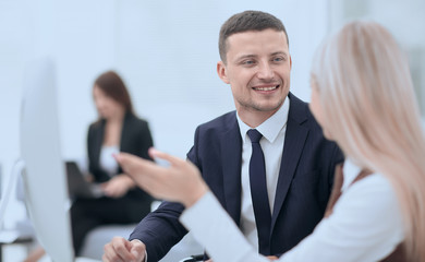 Fototapeta premium Manager talking with a colleague at the workplace