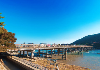 Obraz premium KYOTO, JAPAN - NOVEMBER 7, 2017: View of Togetsu bridge. Copy space for text.