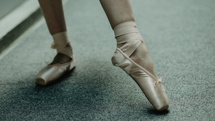 Close up of practice makes perfect- ballerina practices on the dancing hall. Image of ballet shoes...