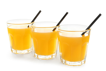 Glasses of tasty citrus juice on white background