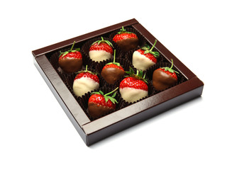 Box with chocolate covered strawberries on white background