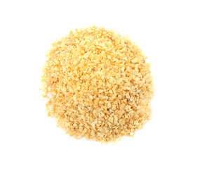 Pile of granulated dry garlic on white background, top view