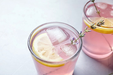 Natural lemonade with lavender in glasses on light background
