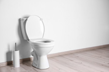 New ceramic toilet bowl in modern bathroom