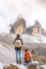 two girls hikers looking at the rocks