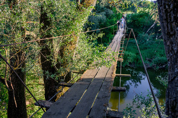Pedestrian suspension bridge across the river
