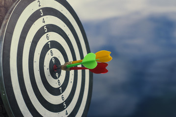Shot three dart arrow in center of dartboard. Concept to target success and winner