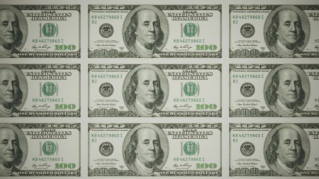 Seamless animation of uncut sheets of old 100 dollars banknotes stacking process