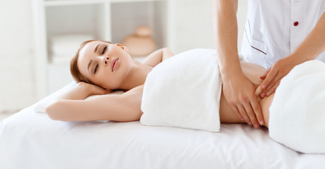 Fototapeta na wymiar beautiful girl enjoys massage and spa treatments