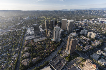 Fototapeta na wymiar Aerial view of Century City towers with the Santa Monica Mountains in background in scenic Los Angeles California.