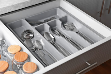 Set of cutlery in kitchen drawer