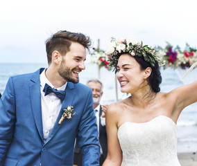 Happy couple at the beach wedding ceremony