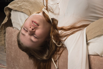 Strangled beautiful business woman in a bedroom