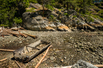 a boat wreck on the rocky beach under the slope near the coast
