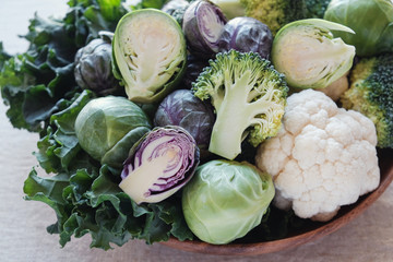 cruciferous vegetables, cauliflower,broccoli, Brussels sprouts, kale in wooden bowl, reducing estrogen dominance, ketogenic diet, plant based vegan food - Powered by Adobe