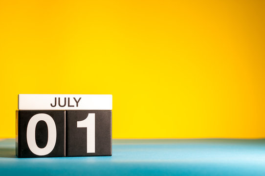 July 1st. Image of july 1, calendar on yellow background with empty space for text. Summer time