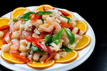 Chinese cuisine. Colorful stir fry in a wok. Shrimps with vegetables