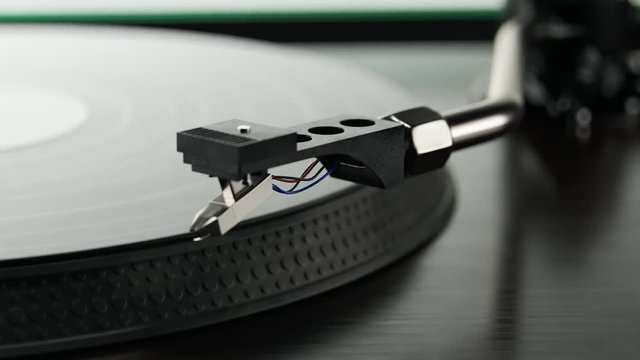 Record player with spinning vintage vinyl playing music, Starting playback. 4K