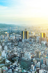 Asia Business concept for real estate and corporate construction - panoramic urban city skyline aerial view under twilight sky and golden sun in Taipei, Taiwan