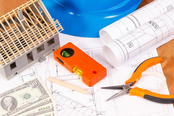 Electrical diagrams, work tools, house under construction and currencies dollar, building home cost concept