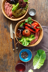 Grilled steak grilled vegetables served in bread plate top view