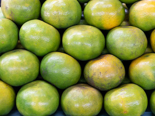 A lot of orange piles in a basket.